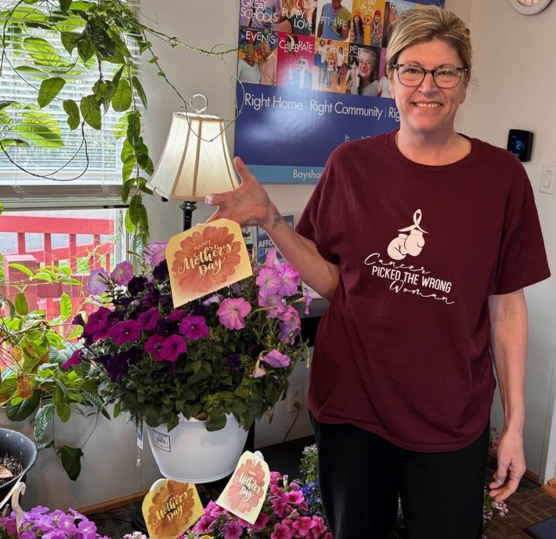 A Bayshore mom holds the flowers she received for Mother's Day