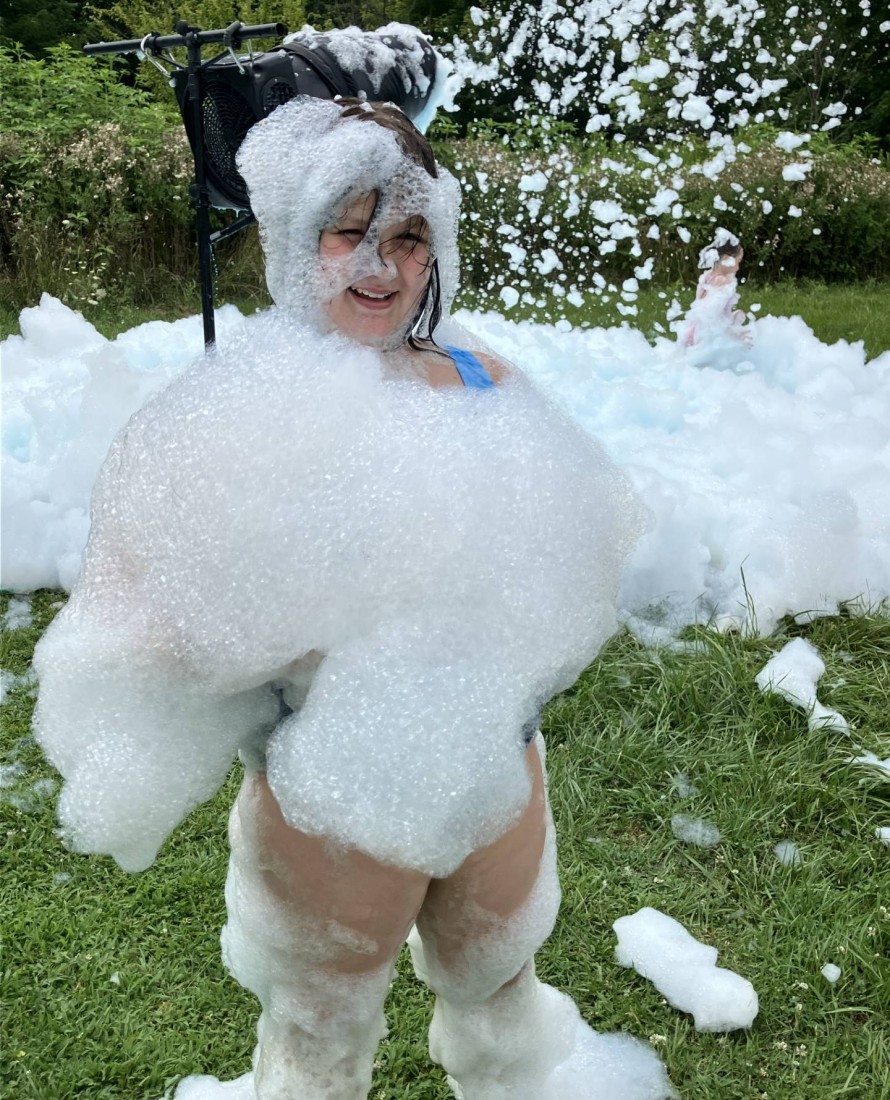 A girl playing with bubbles at a Bayshore summer event