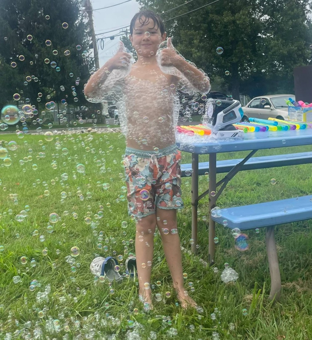 A boy playing with bubbles at a Bayshore summer event