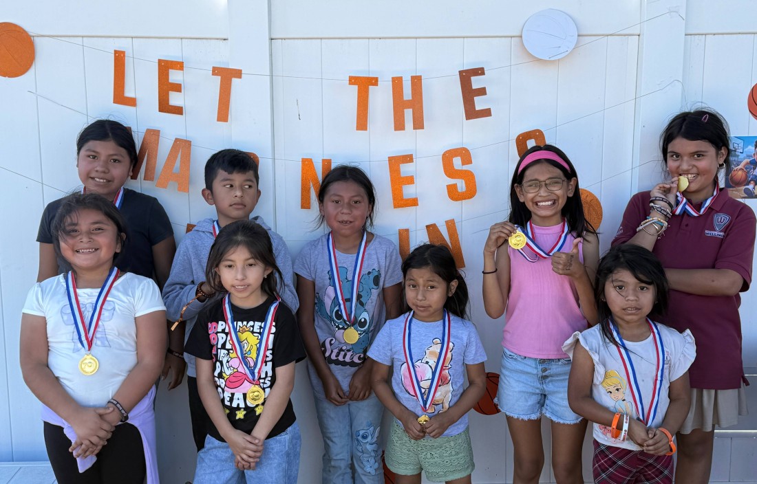 Children from the Colonial Estates community gather for an RHP March Madness Social event