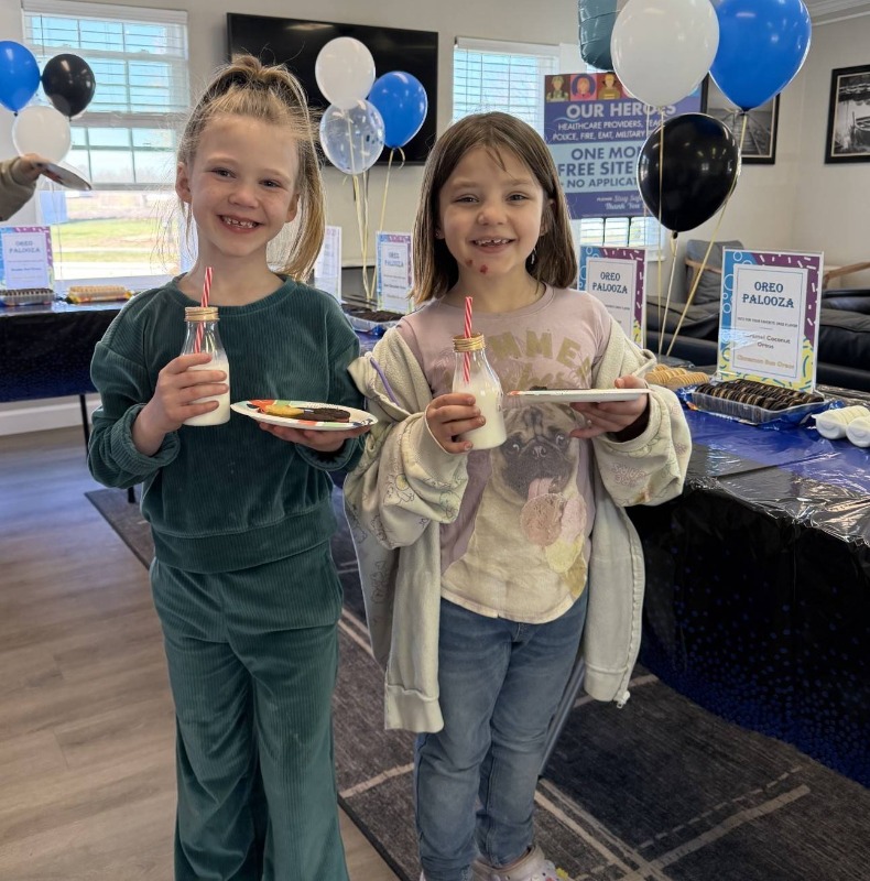 Two kids at a family-friendly social event called Oreo Palooza hosted by a Bayshore manufactured home community