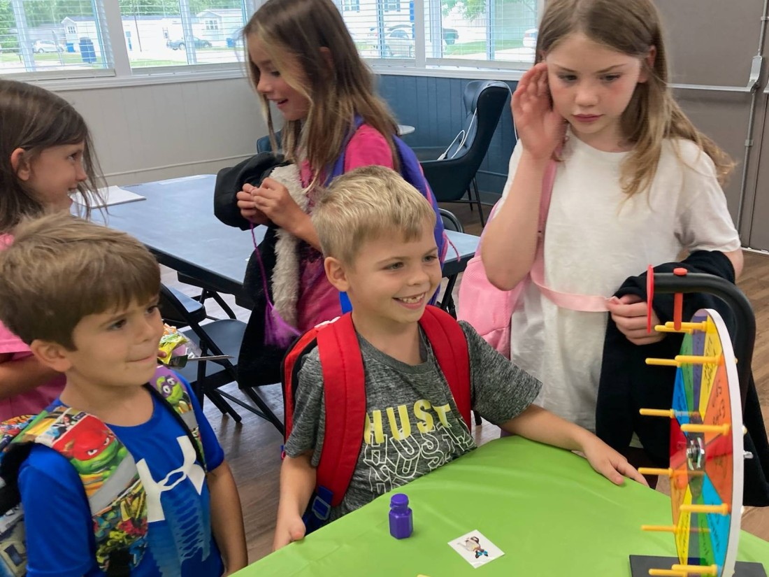 Kids participate in a Bayshore manufactured home community birthday spin and win