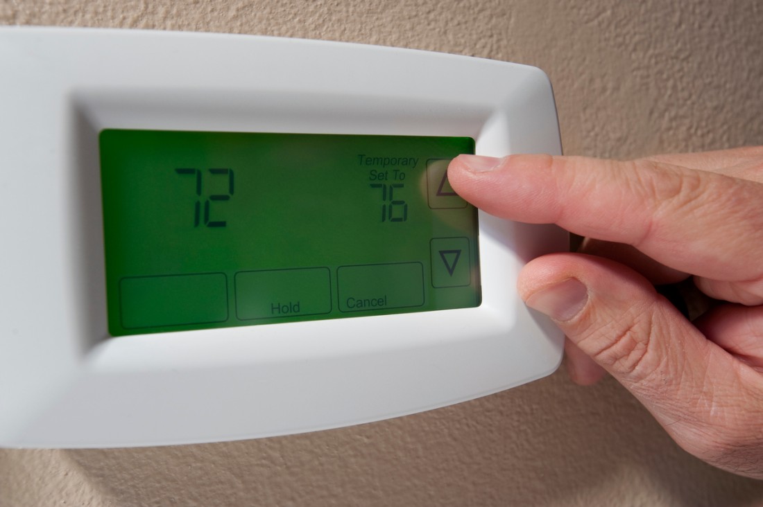 A man turns his thermostat up from 72° to 76° before leaving for work