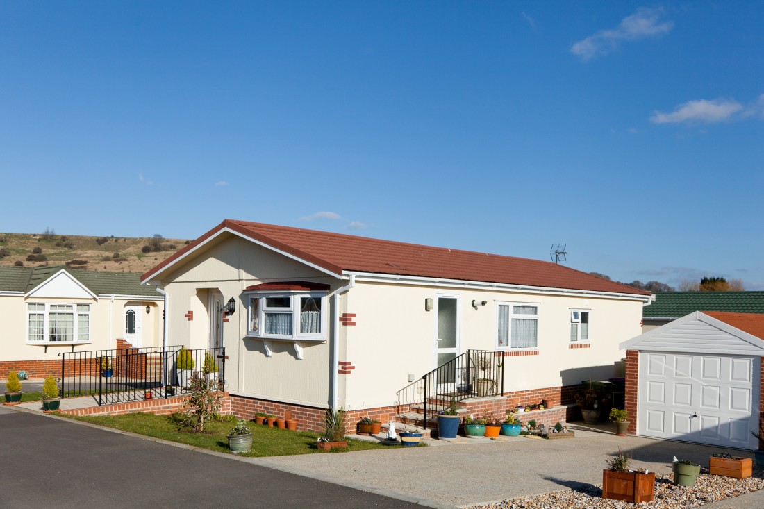 A well-maintained manufactured home community with homes arranged in a neighborhood setting.
