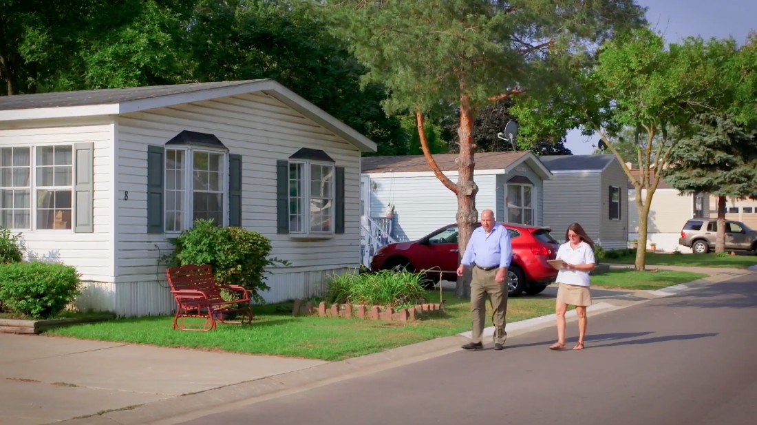 A man tours a Bayshore manufactured home community with a community manager