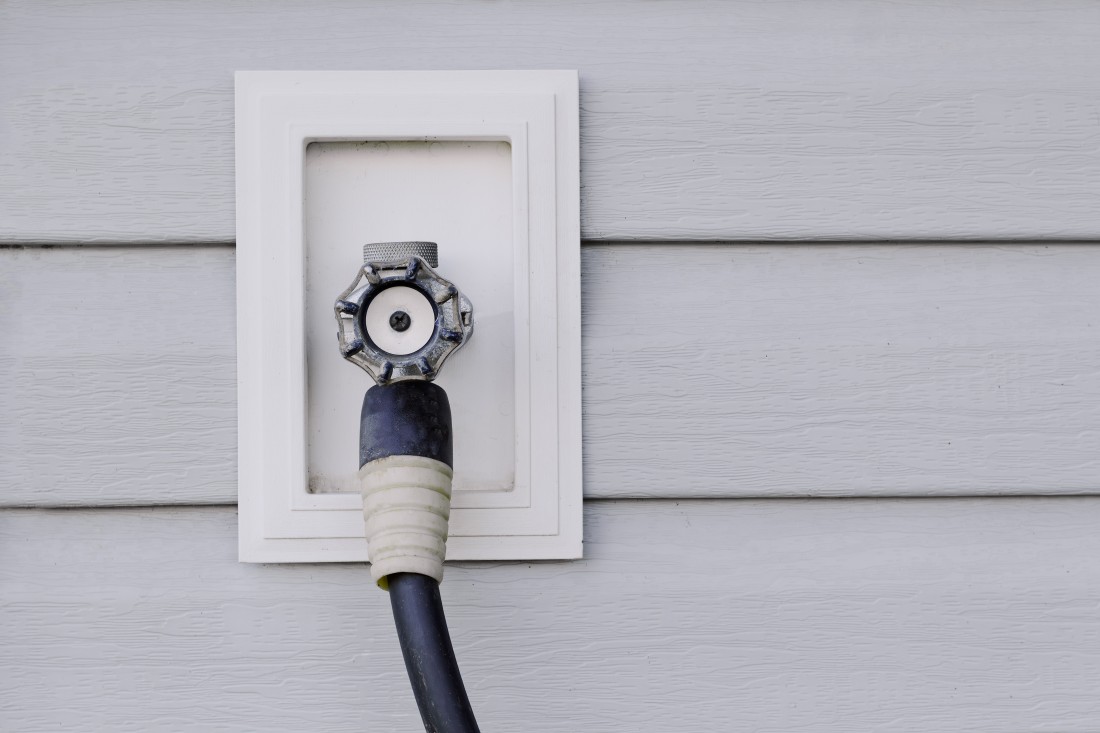 An outdoor faucet and hose, a feature of some manufactured homes that requires fall maintenance